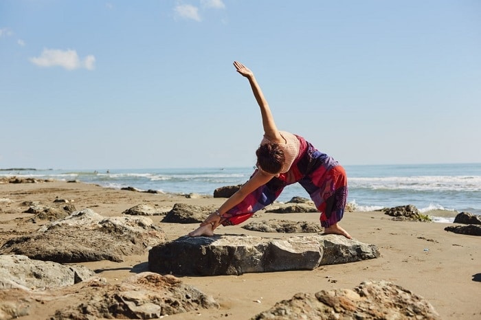 yoga asana on the beach